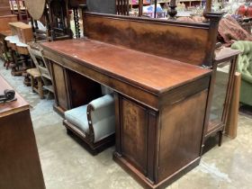 Victorian mahogany twin pedestal sideboard with raised ledge back and two panelled doors below, 199c