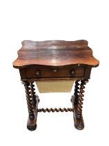 19th century rosewood work table with shaped top, single drawer and needlework well below on twin sp