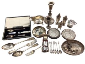 Group of silver to include a gravy boat, condiments, napkin rings, photograph frame, flatware, candl