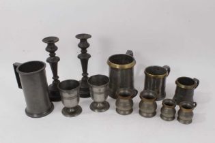 Collection of pewter: Three brass rimmed tankards, one marked 'Battle of The Nile' Rotherhythe, two