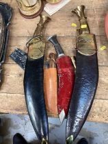 Two large Gurkha Kukri knifes and others
