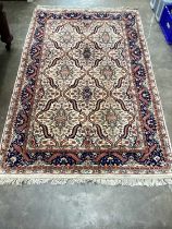 Eastern rug with geometric decoration on beige, blue and red ground