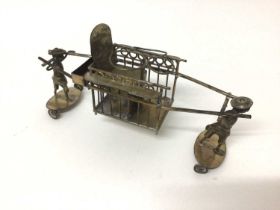 Chinese silver plated model of two men carrying a rickshaw, on wheels, 21cm long