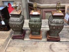 Three Chinese bronze table lamps