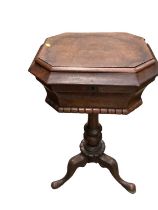 19th century walnut teapoy with hinged lid and fitted interior on turned column and three hipped spl