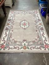 Chinese wash rug with floral decoration on cream and beige ground, 240cm x 153cm