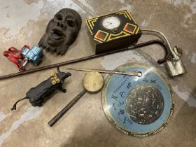 Planisphere, tribal mask, and various other items