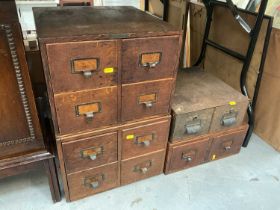 Three Edwardian oak nests of filing drawers and one metal set of drawers
