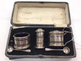 Silver three piece cruet set in fitted case