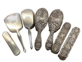 Group of silver mounted dressing table brushes and a mirror