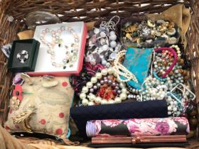 Group of costume jewellery and bijouterie within a wicker basket