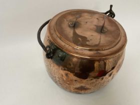 Large Victorian copper cauldron with forged iron handle