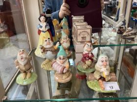 Royal Doulton Snow White and six dwarf figures and six Wade Bear Ambitions figures in boxes