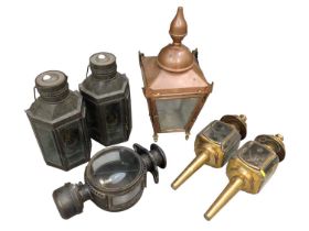 Group of lanterns including a large copper electric lantern and a pair of Victorian style brass carr