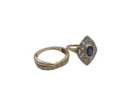 Art Deco style sapphire and diamond ring with a pierced plaque centred with a blue sapphire, in 14ct