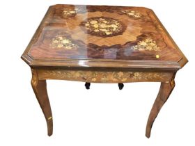 A reproduction games table, the walnut and marquetry inlaid square top lifts off to reveal sliding p