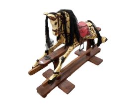 Vintage wooden painted rocking horse.