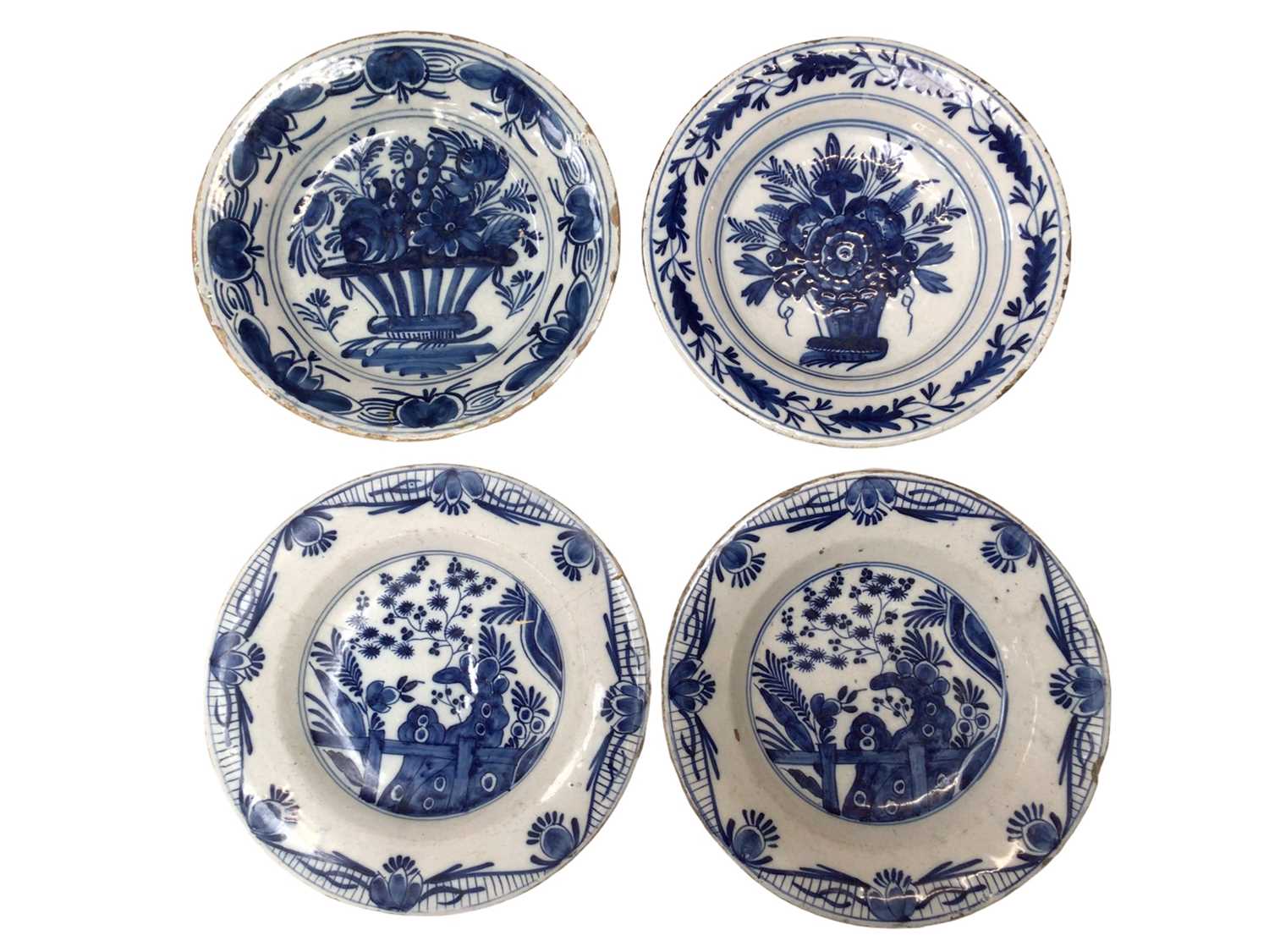 Four 18th century blue and white Delft plates