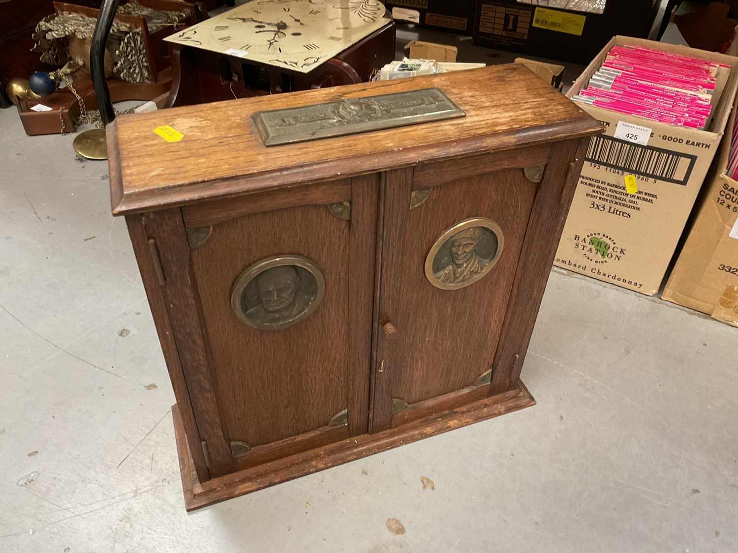 Oak Second World War commorative smokers cabinet with plaques depicting Churchill and Montgomery