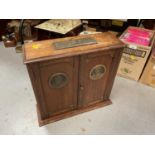 Oak Second World War commorative smokers cabinet with plaques depicting Churchill and Montgomery