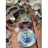 Clobbered Chinese porcelain bowl, blue and white porcelain plate, vases and seated Buddha figure