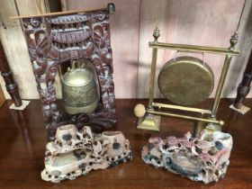 Two Oriental gongs and two soapstone carvings
