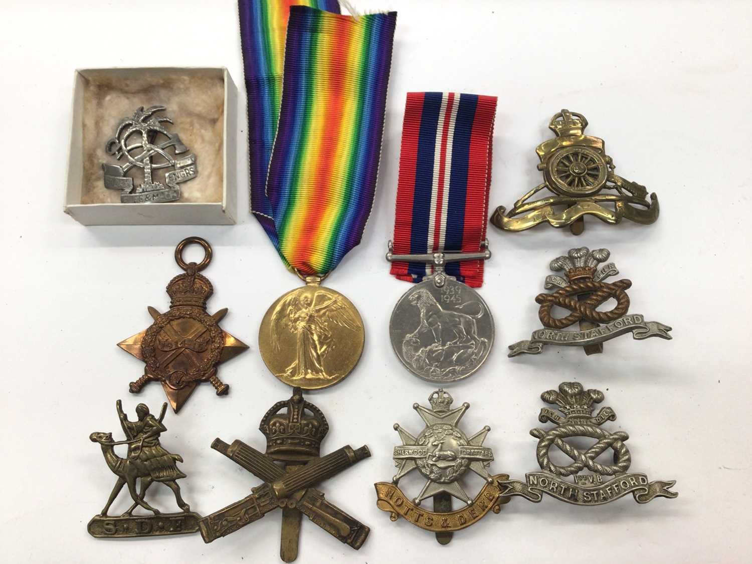 First and Second World War medals, together with various military badges