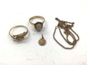 14ct gold opal ring, 14ct gold double dolphin ring, 9ct gold miniature St. Christopher pendant and a