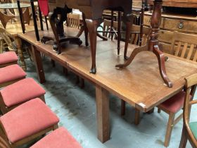 Modern oak extending dining table and set of eight chairs