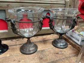 Pair of Classical-style bronzed metal vases with figure surmounts and glass detachable vases