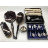 Tortoiseshell and silver hand mirror and brushes, together with silver teaspoons and other items