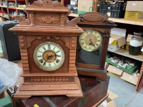 Two early 20th century mantle clocks in carved wood cases (2).