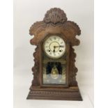 Late 19th century American clock by the Ansonia Clock Co. with 8 day striking movement in 'gingerbre