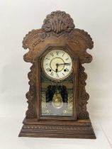 Late 19th century American clock by the Ansonia Clock Co. with 8 day striking movement in 'gingerbre