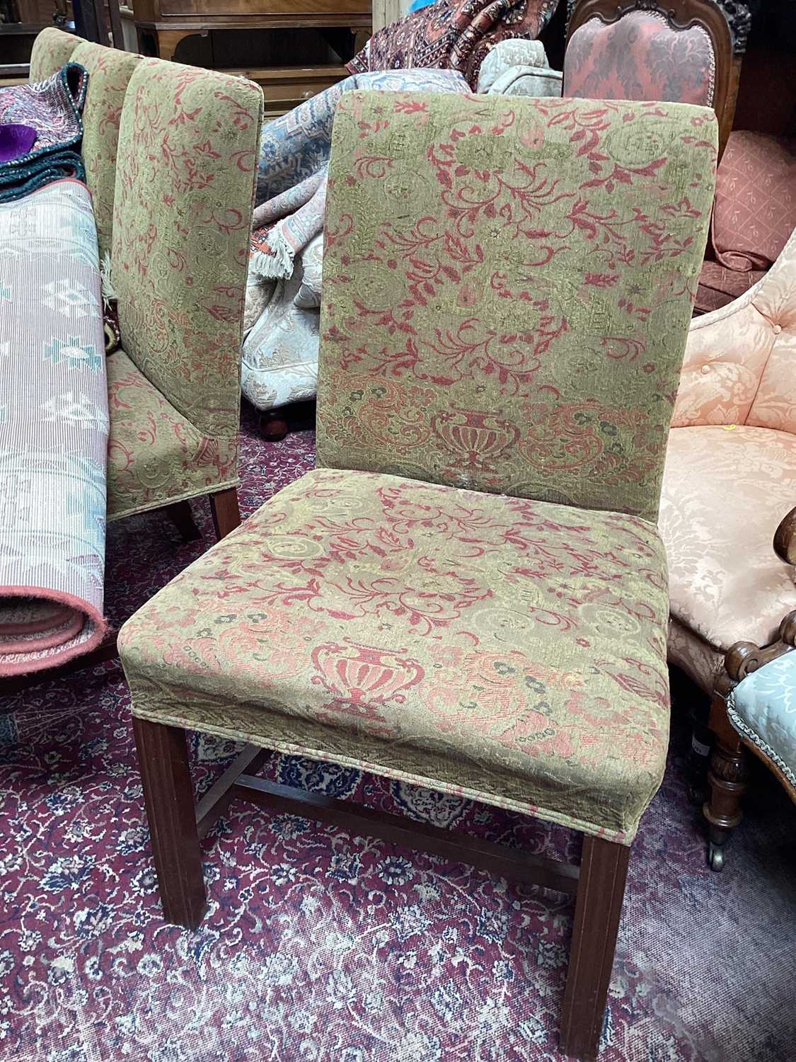 Set of four upholstered dining chairs