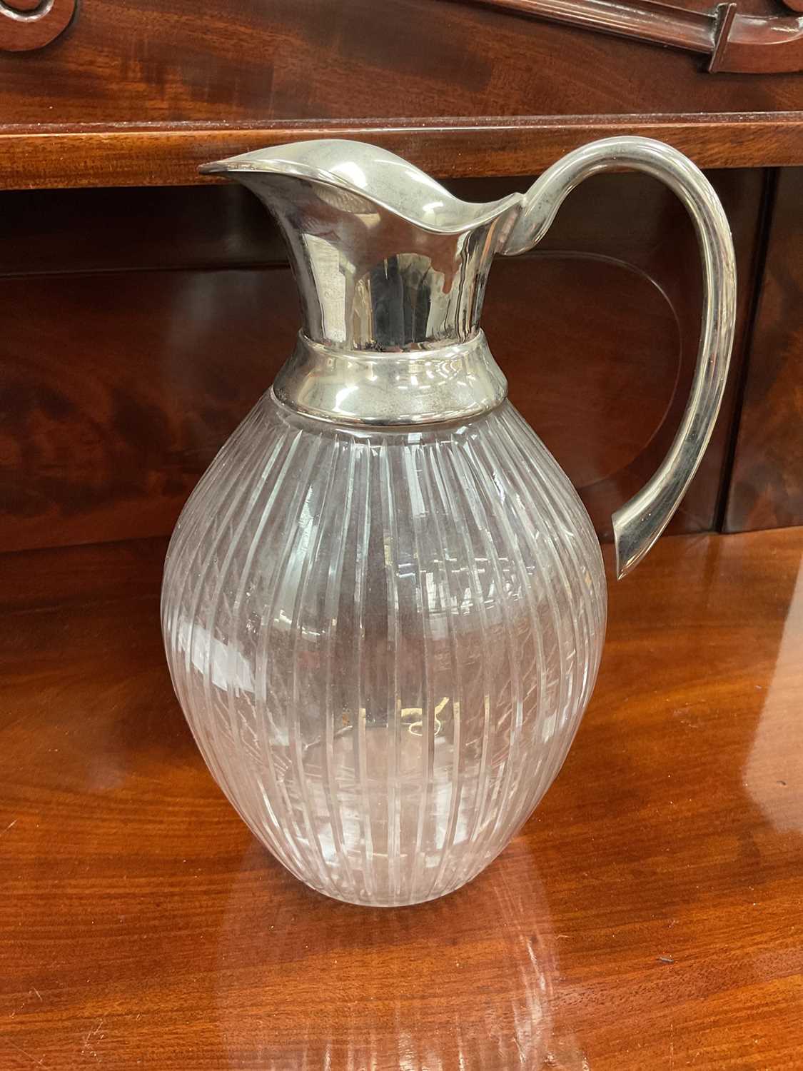 Silver plated lemonade jug with cut fluted body, 24.5cm high