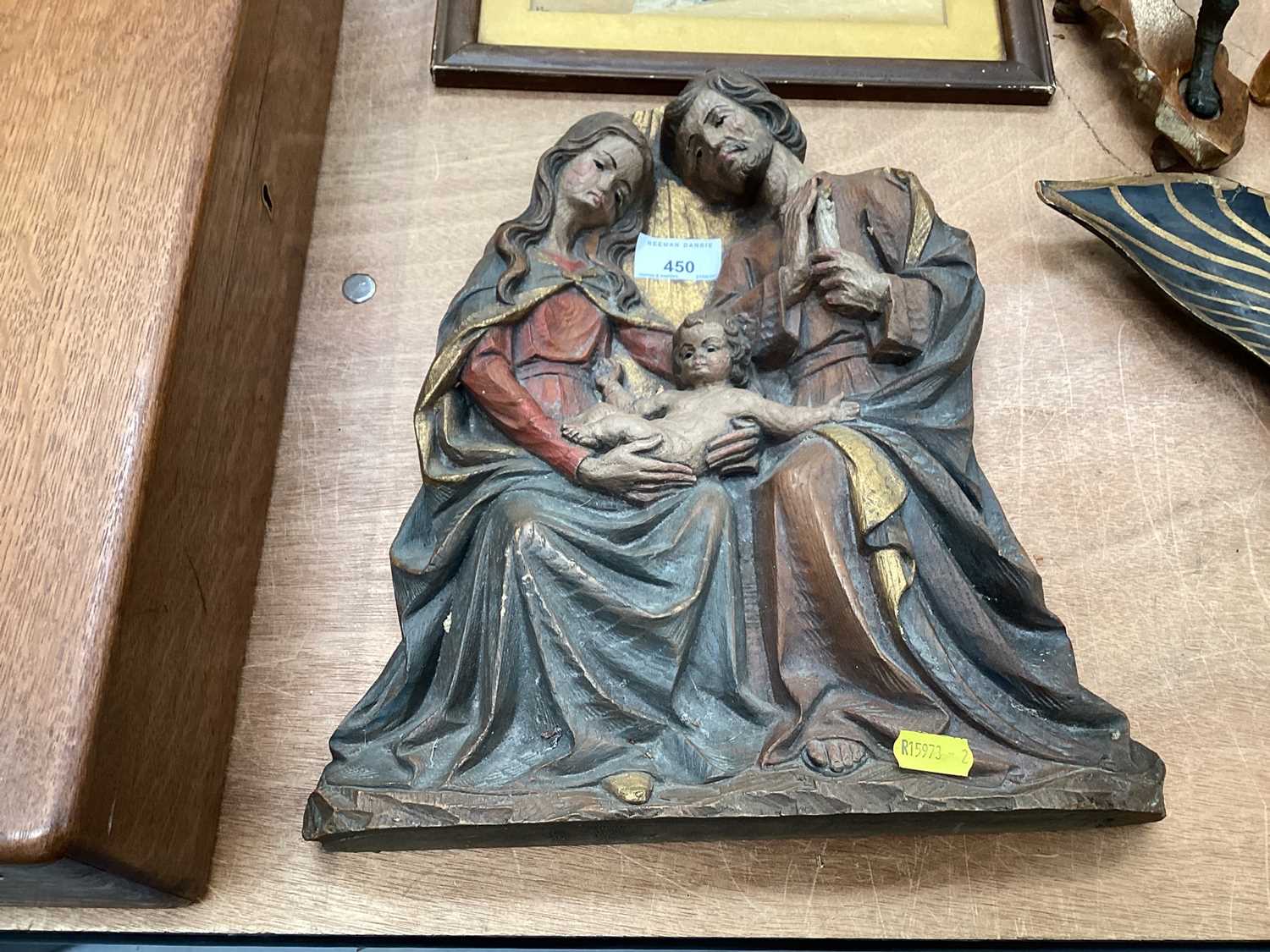 Carved oak religious scene depicting an infant Jesus wit Mary and Joseph.