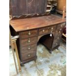 Edwardian inlaid mahogany bowfront kneehole desk with seven drawers and on cupboard below, 112cm wid