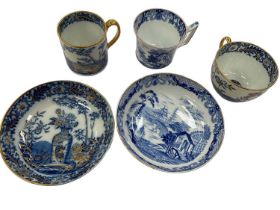 Wedgwood blue printed coffee cup and saucer, and another blue printed trio