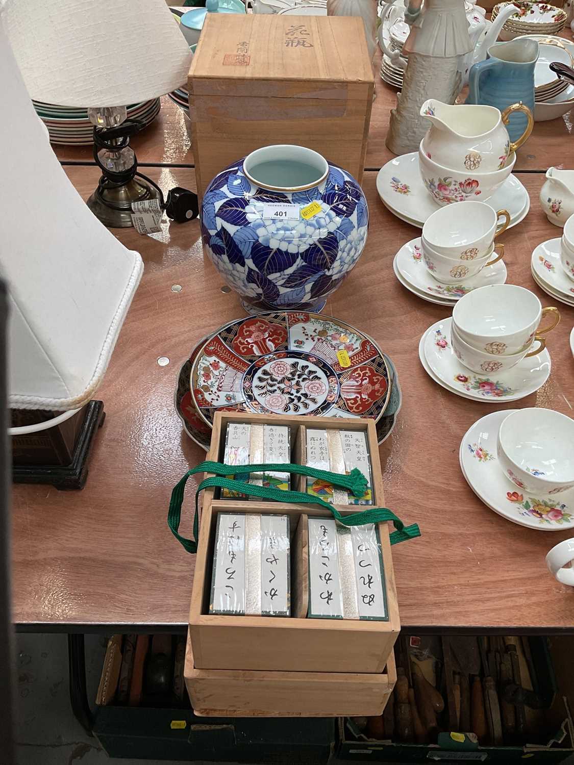 Japanese vase in box, together with two Japanese Imari plates and a boxed Japanese card game (4).