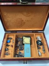 Chinese style wooden jewellery box containing a silver charm bracelet, silver brooches, other antiqu