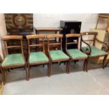 Set of five 19th century mahogany bar back dining chairs with green seats on sabre legs, comprising
