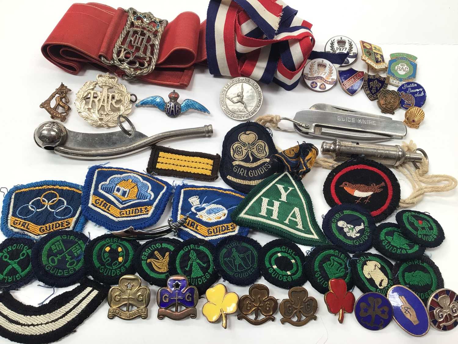 Collection of mostly Girl Guides cloth badges, enamelled pins, penknife etc, RAF silver and enamel s