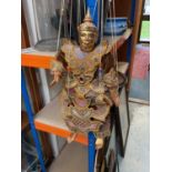 Asian carved gilt wood puppet with embroidered clothing
