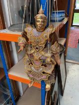 Asian carved gilt wood puppet with embroidered clothing