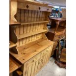 Pine two height dresser with shelves above, two drawers and cupboards below, 136cm wide, 50cm deep,
