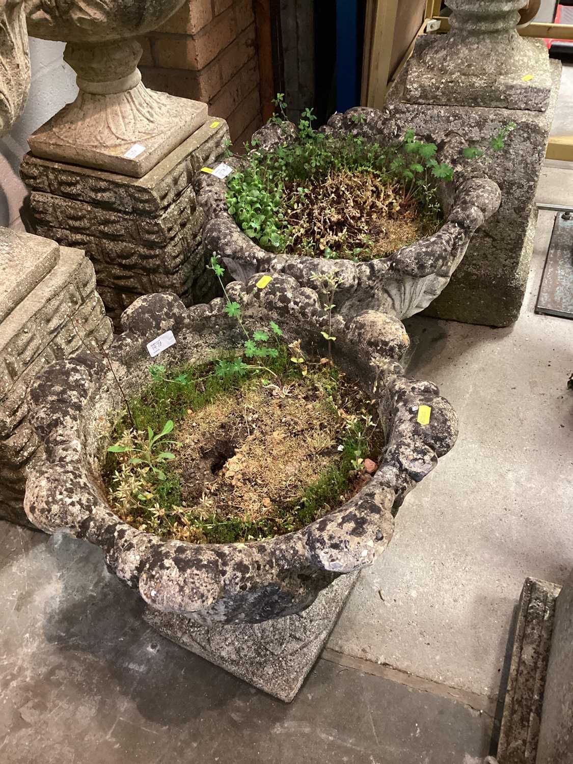 Concrete garden urn on plinth base, 86cm high, together with another pair of urns, 43.5cm high