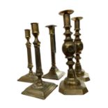 Pair of George III brass candlesticks, another and pair of Victorian candlesticks
