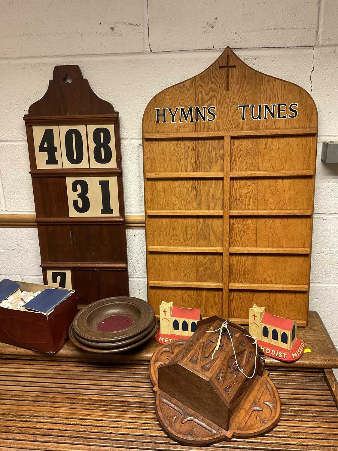 Carved oak offertory box, and three oak dishes, also two hymm boards and cards, two vintage church f