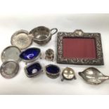 Silver photograph frame, various silver salts, silver pepperette, silver dish, three other plated di